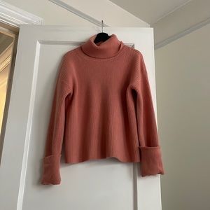 Ribbed turtleneck peach sweater